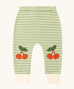 Little Green Radicals cherry knee patch green cream striped organic cotton joggers.