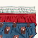 Close up of the elasticated waist on the Little Green Radicals children's organic cotton underwear 3 pack bears design. Brief style pants one navy with a brown bear print, one red and one blue and white stripes. 