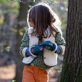 A child wearing the Little Green Radicals Children's Sherpa Fleece Gilet in the red foxes design. This gilet is a part of a wide range of organic cotton clothing for children available here at Babipur. 