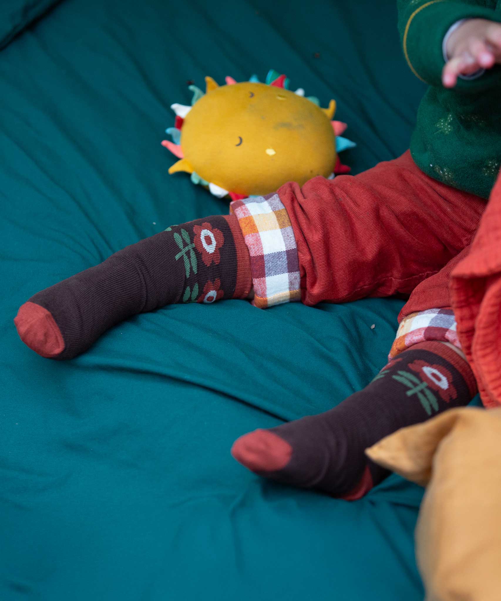 A close up of the retro style flower print socks from the Little Green Radicals Kids Ankle Socks 3 Pack. These organic cotton children's socks are  part of a wide range of organic cotton clothing for children available here at Babipur. 