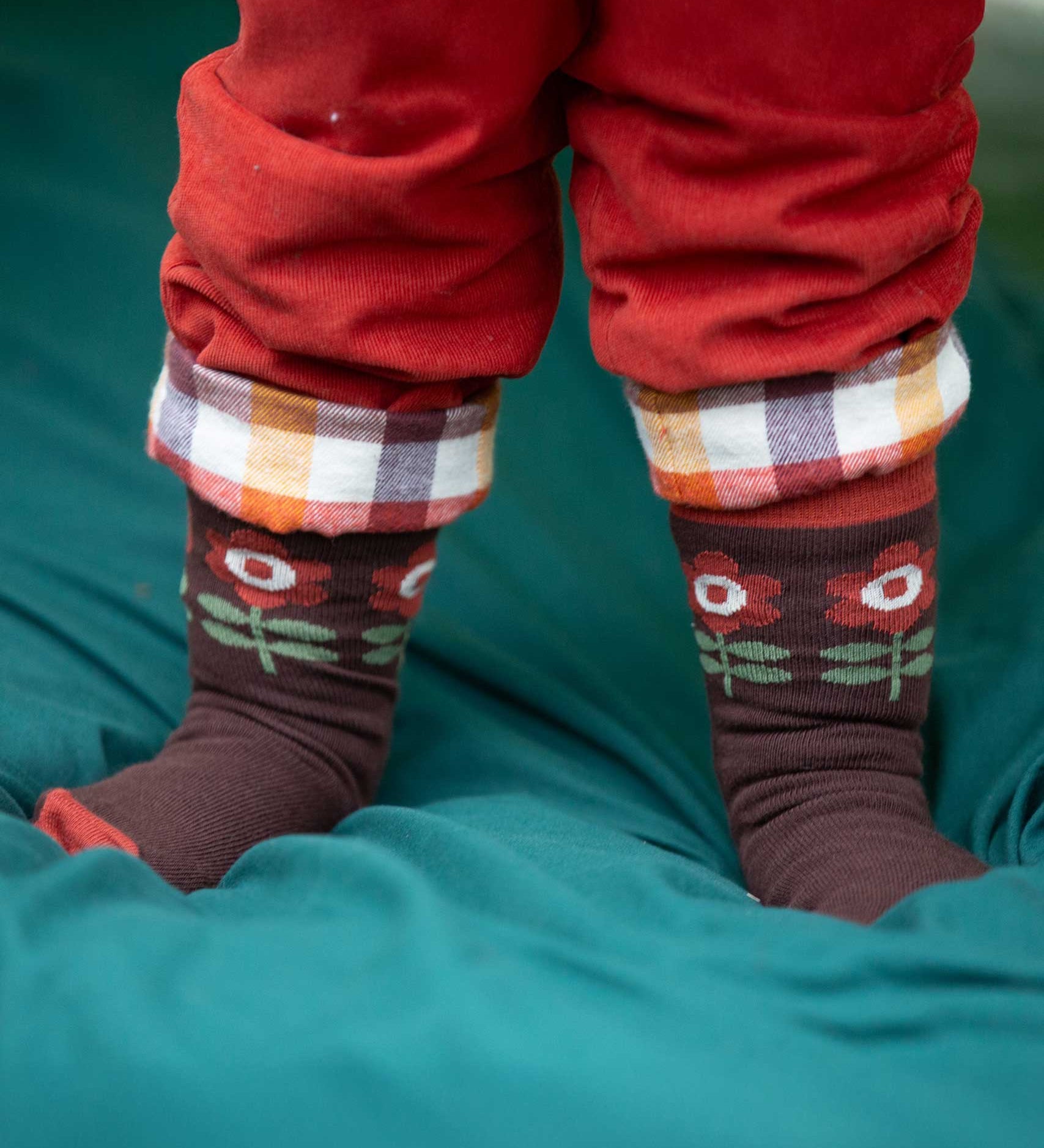 A close up of the retro style flower print socks from the Little Green Radicals Kids Ankle Socks 3 Pack. These organic cotton children's socks are  part of a wide range of organic cotton clothing for children available here at Babipur. 