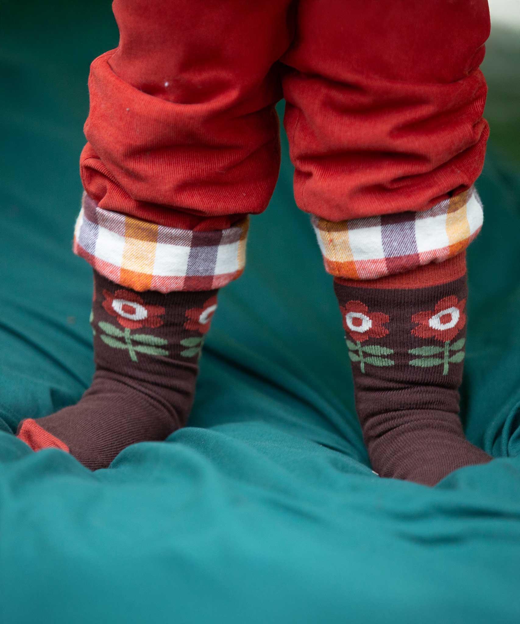 A close up of the retro style flower print socks from the Little Green Radicals Kids Ankle Socks 3 Pack. These organic cotton children's socks are  part of a wide range of organic cotton clothing for children available here at Babipur. 