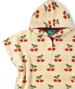 Red lined hood on the Little Green Radicals little cherries organic cotton baby towel poncho.