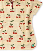 kangaroo pocket on the front of the Little Green Radicals little cherries cream organic cotton kids hooded towel poncho.The poncho has a popper closure on the neck and a kangaroo pocket on the front. 