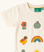 Close up of the Little Green Radicals cream vintage style kids organic cotton t-shirt showing the printed details on the front.