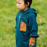 Child wearing a Little Green Radicals children's atlantic deep blue organic cotton quarter zip hoodie.