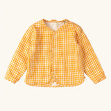 Little Green Radicals children's Flora Reversible Spring Jacket shown on the yellow cold gingham print side. 