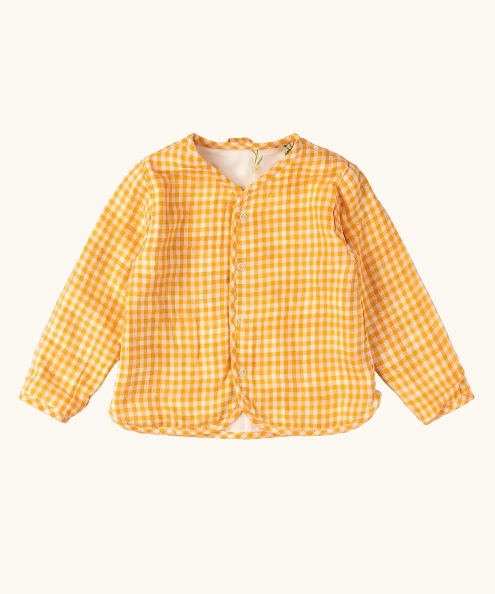 Little Green Radicals children's Flora Reversible Spring Jacket shown on the yellow cold gingham print side. 
