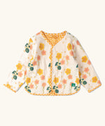 Little Green Radicals children's Flora Reversible Spring Jacket in cream. Yellow and pink repeat flower print on a cream background.