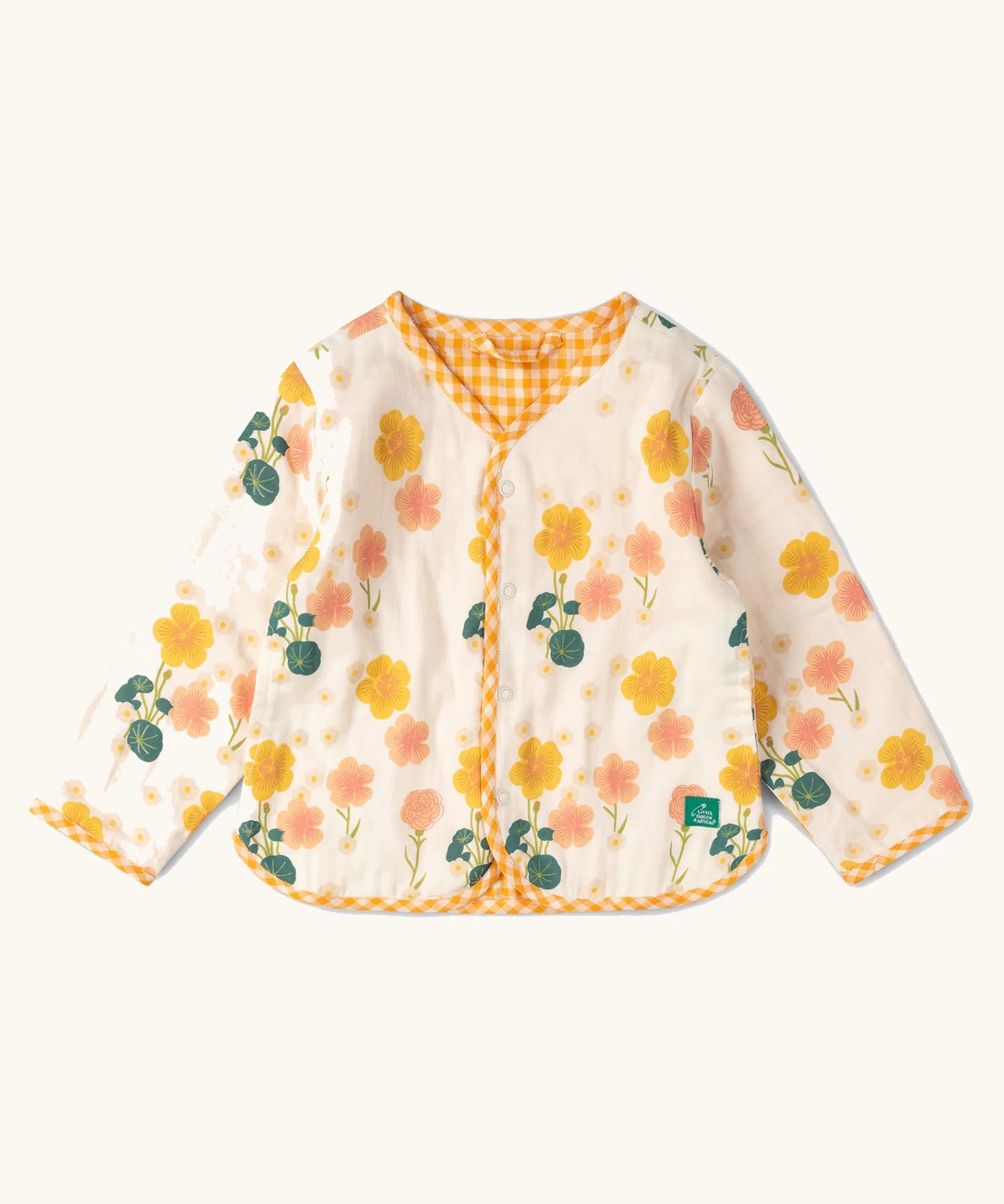 Little Green Radicals children's Flora Reversible Spring Jacket in cream. Yellow and pink repeat flower print on a cream background.