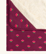 Close up of the hood on the Little Green Radicals pink flowers organic cotton sherpa hooded baby blanket.