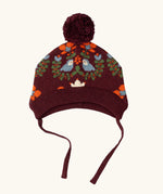 Little Green Radicals folk birds knitted purple bobble hat with chin tie straps.