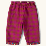 Little Green Radicals folk birds organic cotton reversible pull on trousers shown on the pink check side.