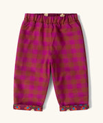 Little Green Radicals folk birds organic cotton reversible pull on trousers shown on the pink check side.