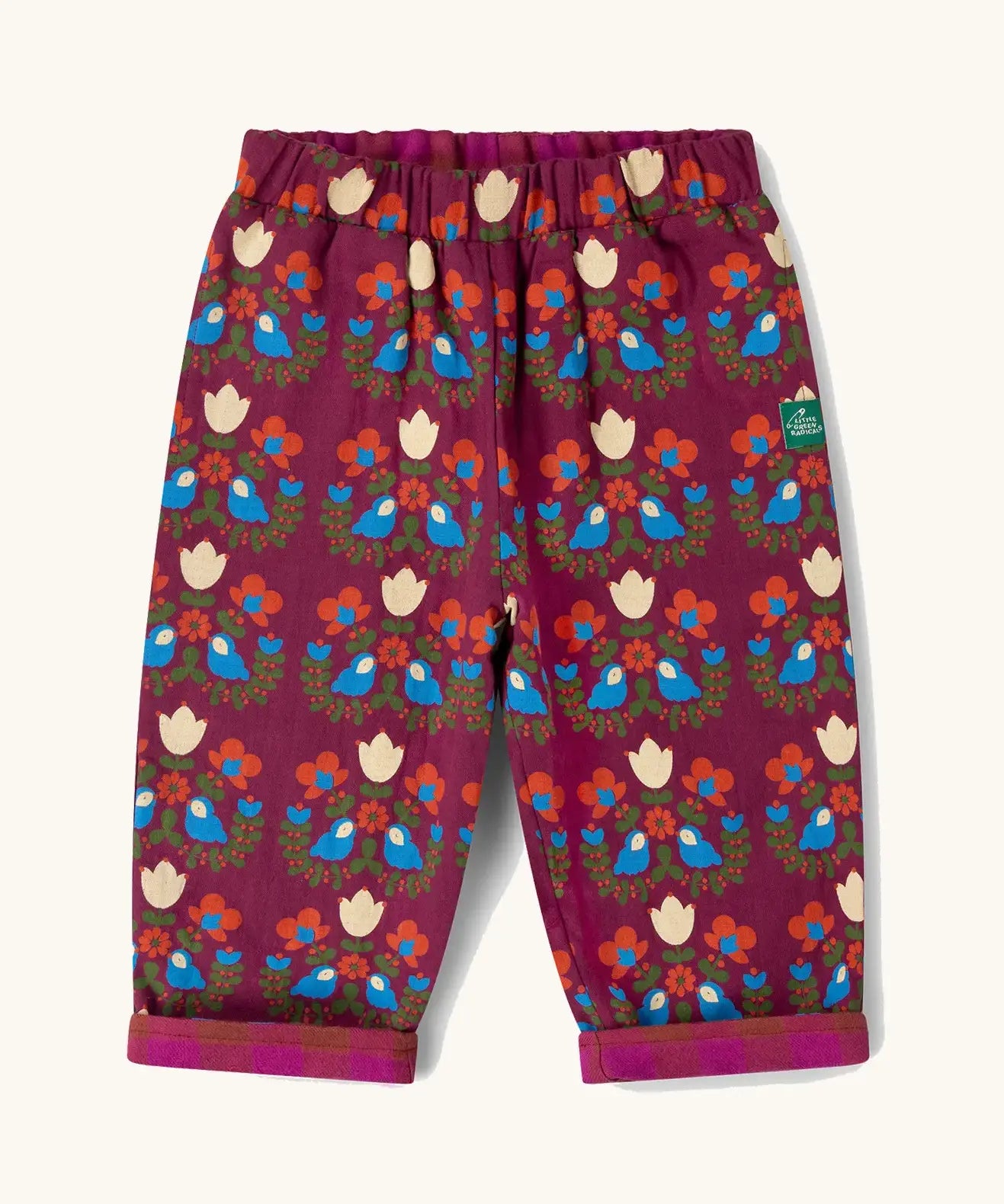 Little Green Radicals folk birds organic cotton reversible pull on trousers. Deep pink background with a repeat bird and flower print.