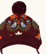 Little Green Radicals folk birds knitted purple bobble hat, close up showing the details on the design