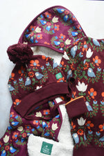 Little Green Radiclas Folk Birds print purple hooded blanket knitted hat and knitted jumper. 