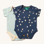The Little Green Radicals Full Moon Organic Cotton Baby Body Set on a plain background. One body suit has a moon and cloud print on a blue background the second has a cream and blue striped design. 