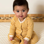Little Green Radicals Organic 2 Pack Baby Body Set - a baby wearing the yellow gold striped babygrow. 