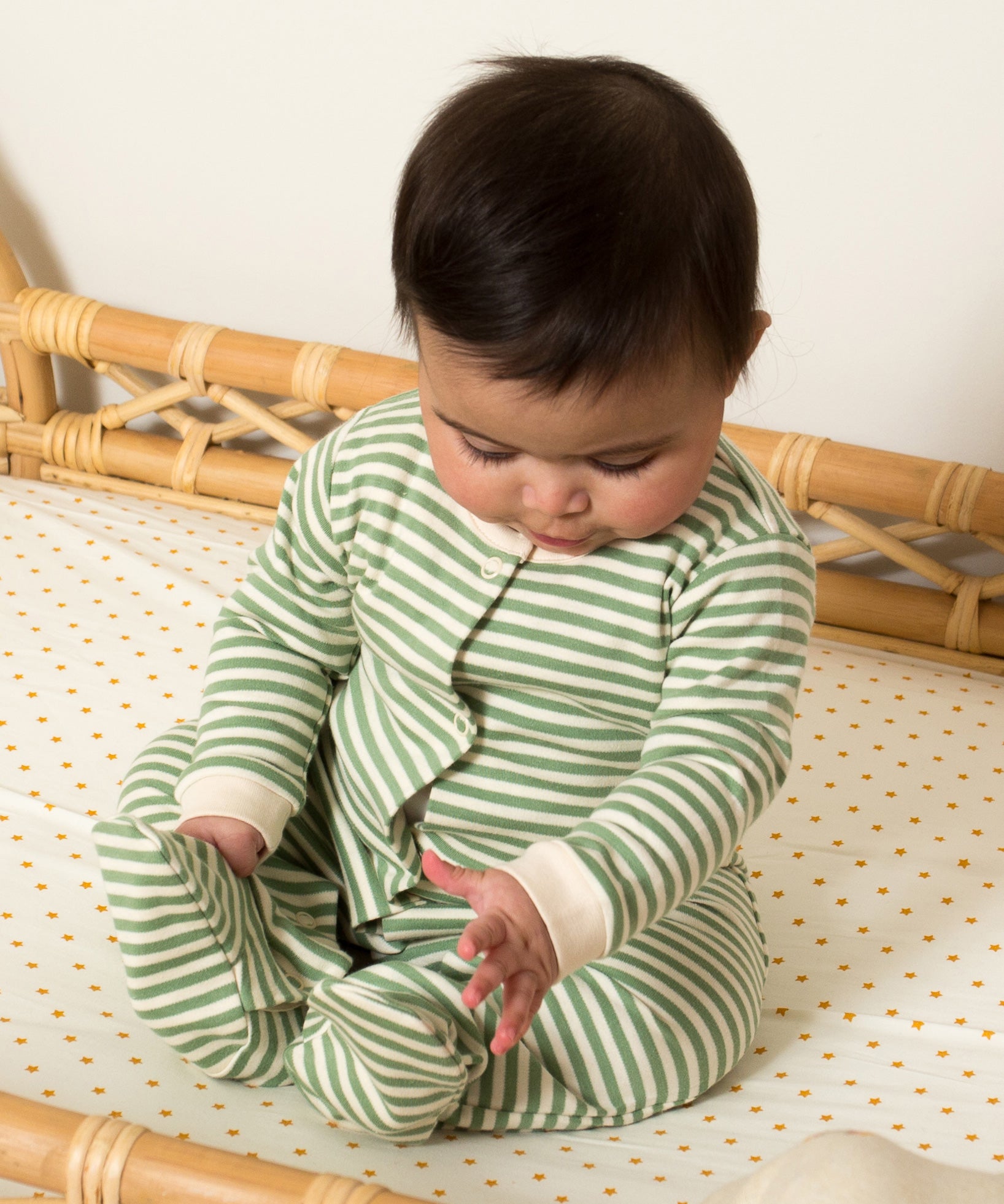 Little Green Radicals Organic 2 Pack Baby Body Set - a baby wearing the green and white striped babygrow. 