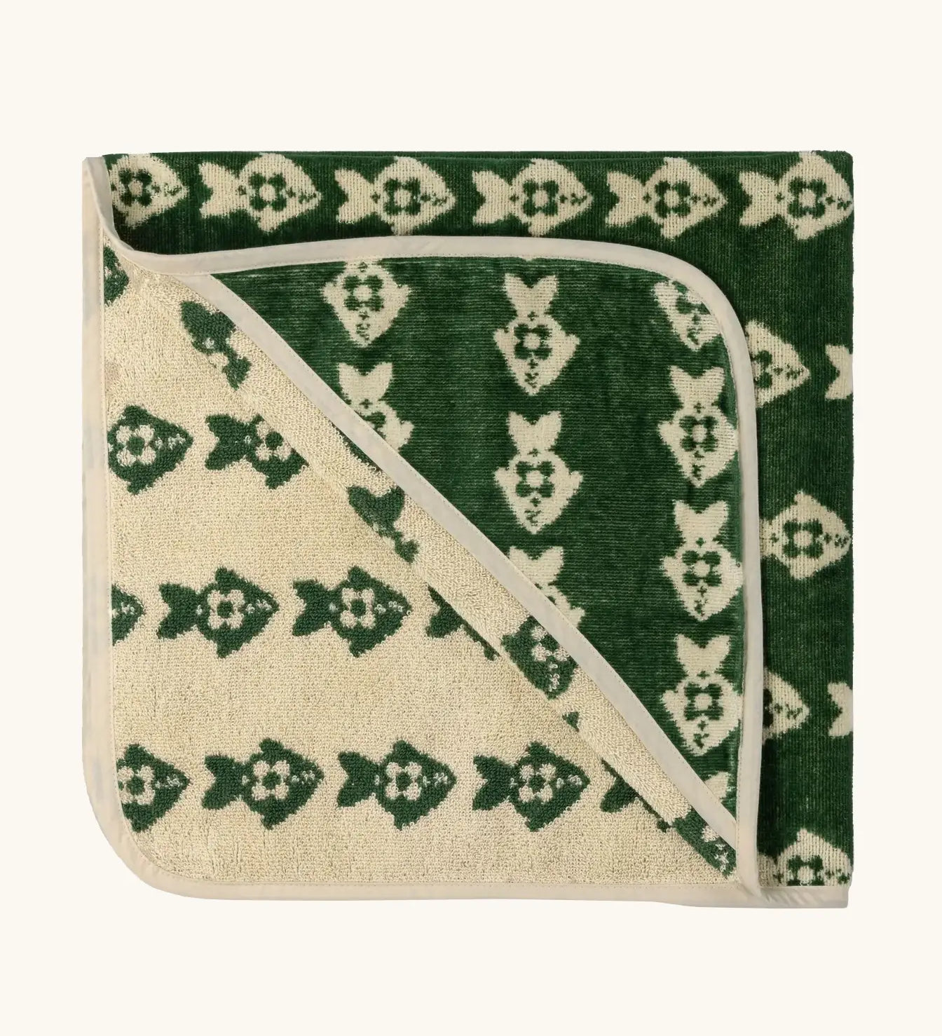 Little Green Radicals GOTS organic cotton hooded towel in green and cream with a repeating fish design folded into a square