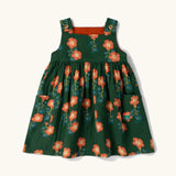 Little Green Radicals green orange blooms repeat print reversible pinny kids dress.