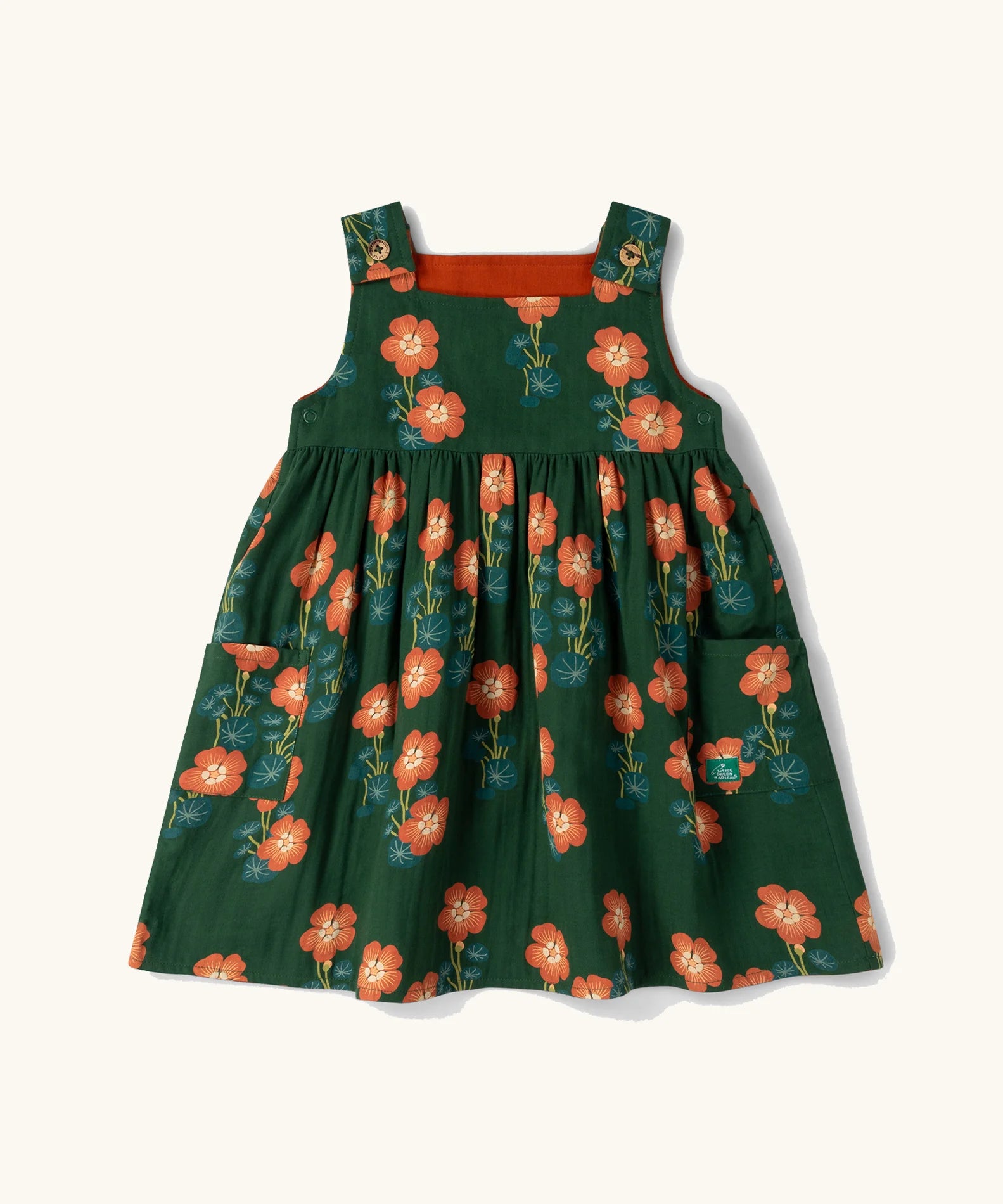 Little Green Radicals green orange blooms repeat print reversible pinny kids dress.
