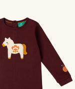 Close up of the horse applique on the front of the Little Green Radicals kids brown horse organic cotton long sleeve top.