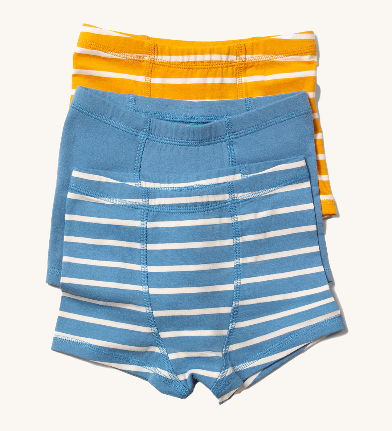 Little Green Radicals organic Cotton Boxer Shorts Underwear Set containing one blue and white striped boxer shorts, one plain blue and one yellow and white striped pair.