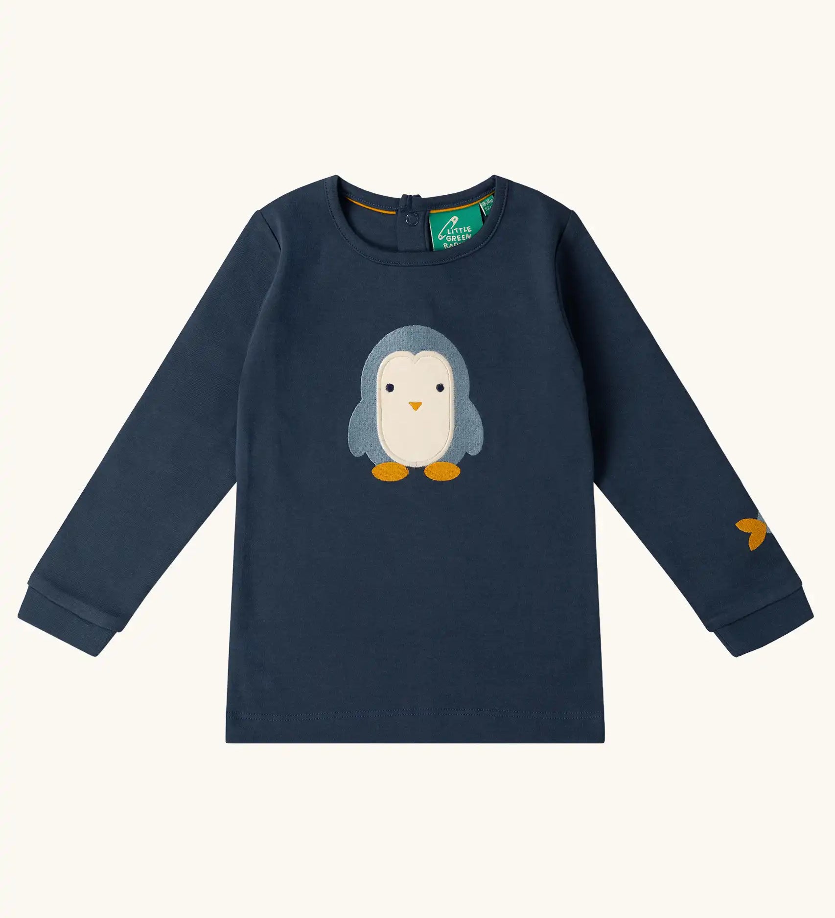 Little Green Radicals blue penguins applique long sleeve organic cotton top in navy.