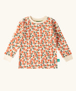 Top from the Little Green Radicals petals kids organic cotton pyjamas. Cream coloured pyjamas with an all over repeat pink flower print.