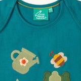 Close up of envelope style neck on the Little Green Radicals Spring garden embroidered organic cotton green t-shirt. 