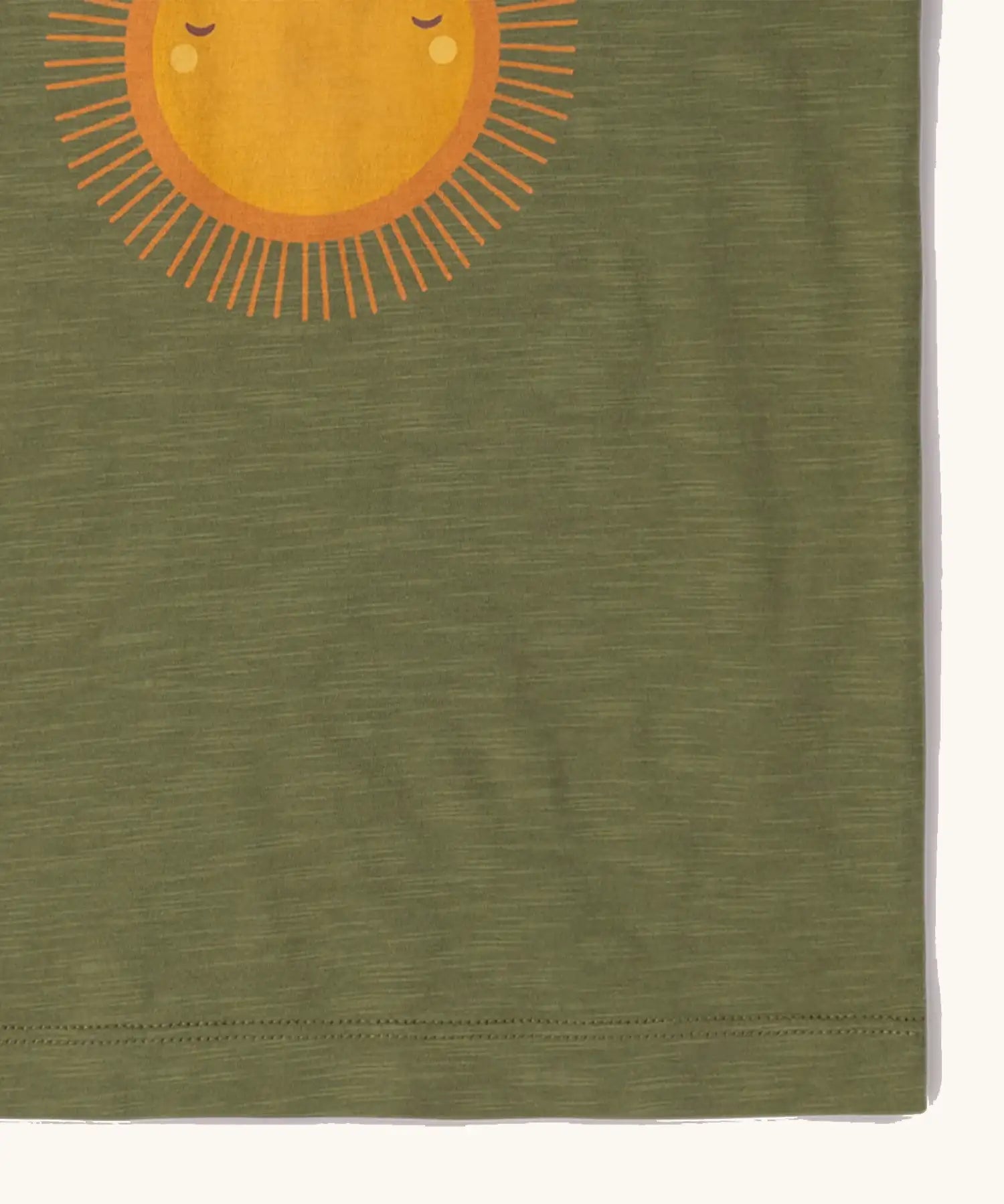 Close up of him on the Little Green Radicals Summer rays sunshine short sleeve green popper organic-cotton t-shirt.