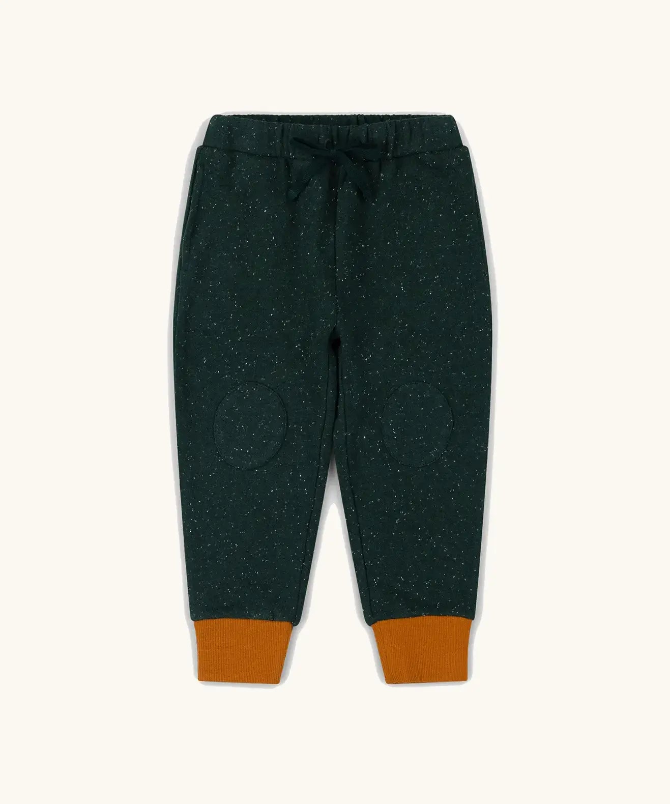 Little Green Radicals cosy organic cotton knee patch joggers in forest green with yellow gold cuffs. 
