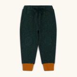Little Green Radicals cosy organic cotton knee patch joggers in forest green with yellow gold cuffs. 