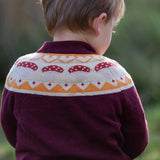 Close up of the mushrooms design on the Little Green Radicals knitted organic cotton jumper with a mushroom Fair Isle design.