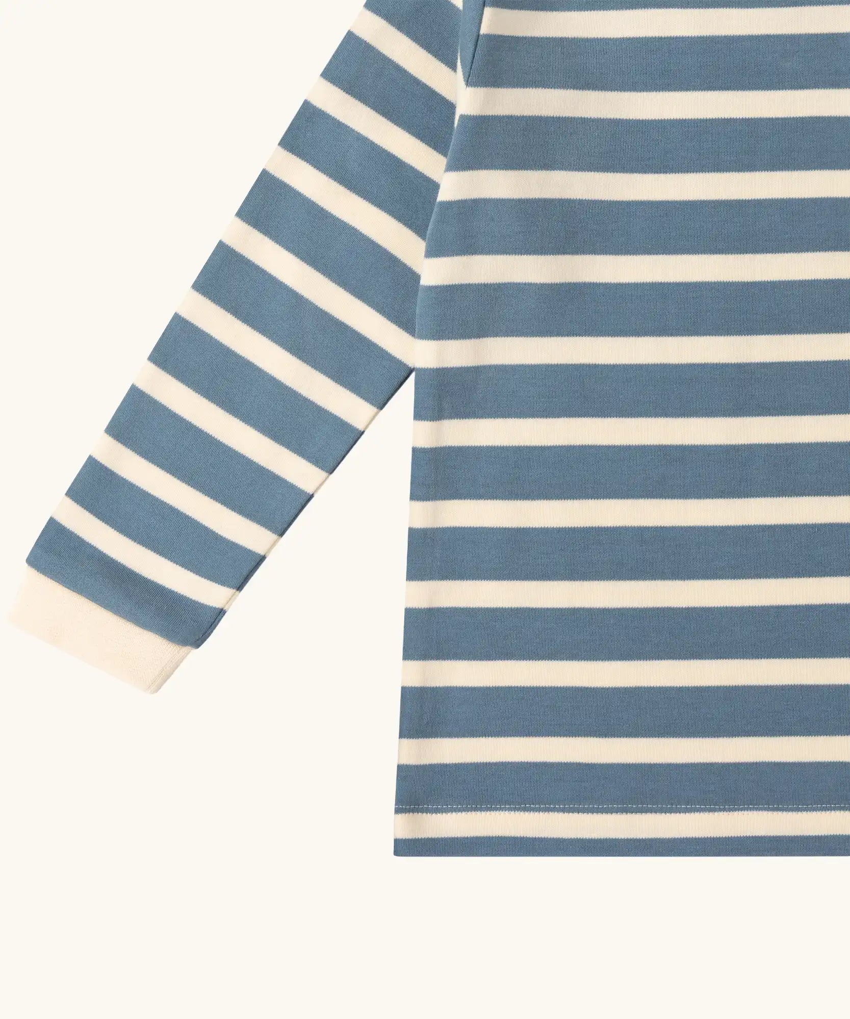 Close up of the Little Green Radicals soft blue stripe organic cotton long sleeve children's top.