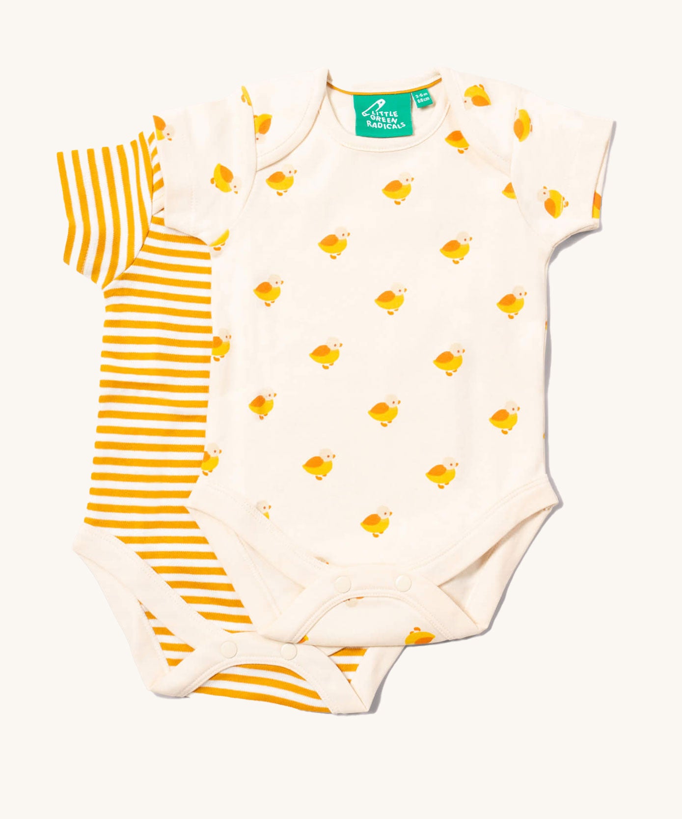 Little Green Radicals Little Ducks Organic 2 Pack Baby Body Set . One vest has an all over yellow coloured duck print on a cream background the other vest has a cream and yellow gold coloured stripe. 