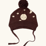 Little Green Radicals brown organic cotton moon knitted bobble hat with chin strap ties.