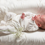 little-green-radicals-natural-babygrow-worn-by-small-baby
