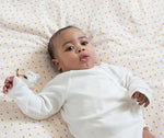 Baby wearing LGR natural long sleeve wrap