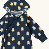 Close up of the  Little Green Radicals navy blue penguins hooded reversible snug suit showing the thumb holes on the wrist cuffs.