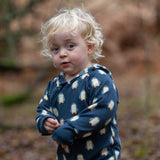 Child wearing a Little Green Radicals navy blue penguins hooded reversible snug suit.