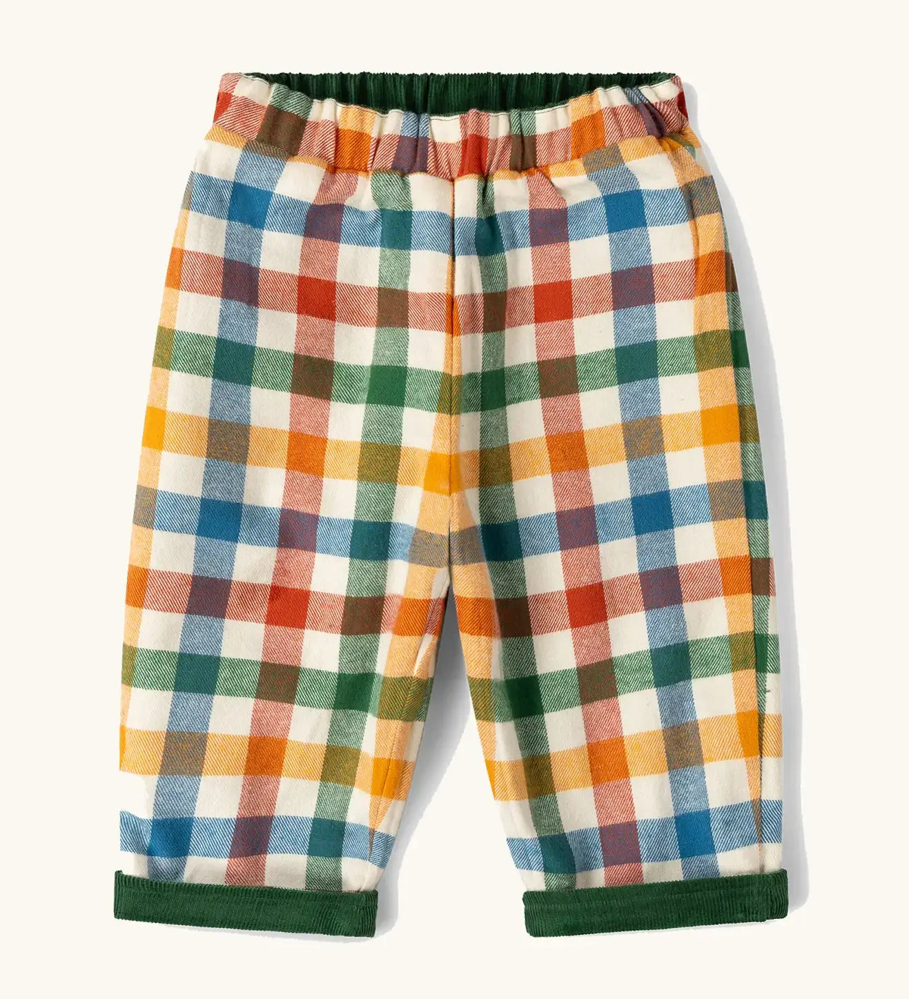 Little Green Radicals olive green organic cotton reversible pull on trousers shown on multi coloured check side. 