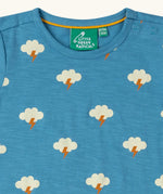 Close up of the poppered neck closure on the Little Green Radicals blue all weather repeat print organic cotton short sleeve t-shirt.