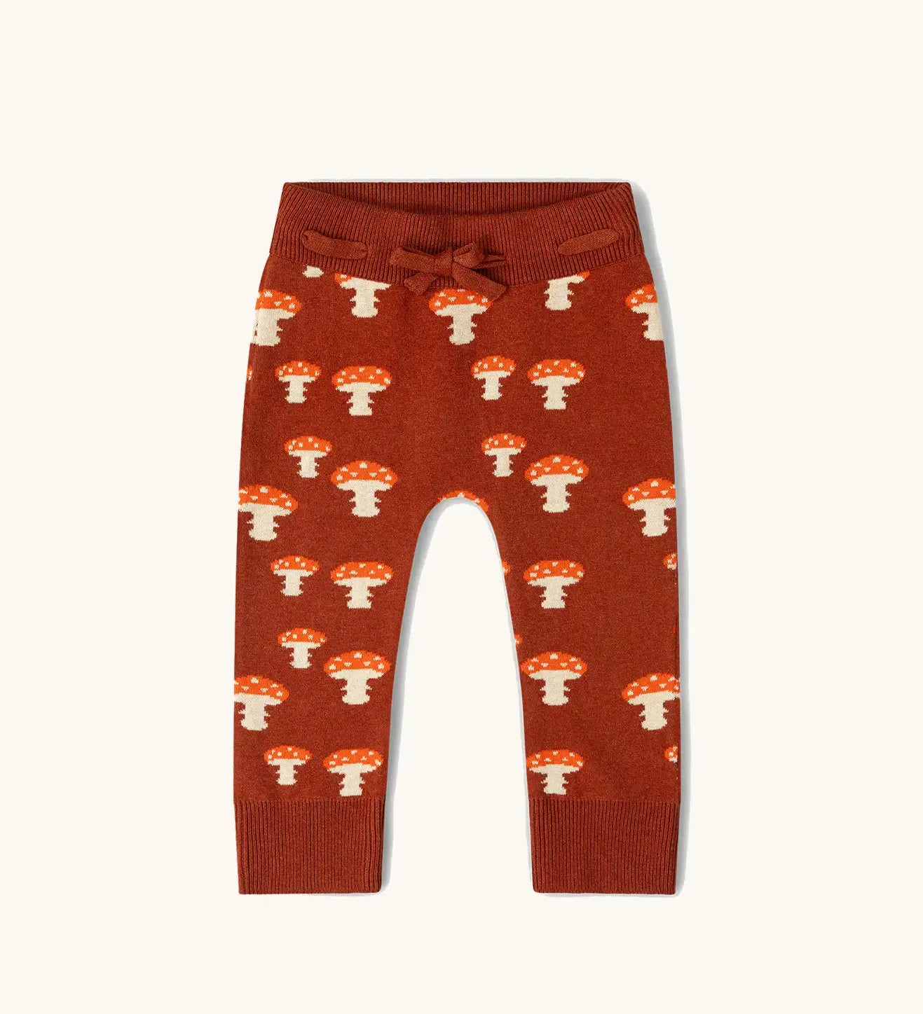 Little Green Radicals organic cotton children's knitted joggers with a mushroom design.
