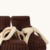 Close up of the front of the Little Green Radicals hazelnut brown organic cotton knitted baby booties.