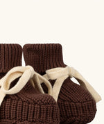 Close up of the front of the Little Green Radicals hazelnut brown organic cotton knitted baby booties.