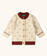Little Green Radicals organic cotton knitted cardigan with snow penguins design. Natural cream cardigan with penguins all over, maroon trim on the collar and hem line.