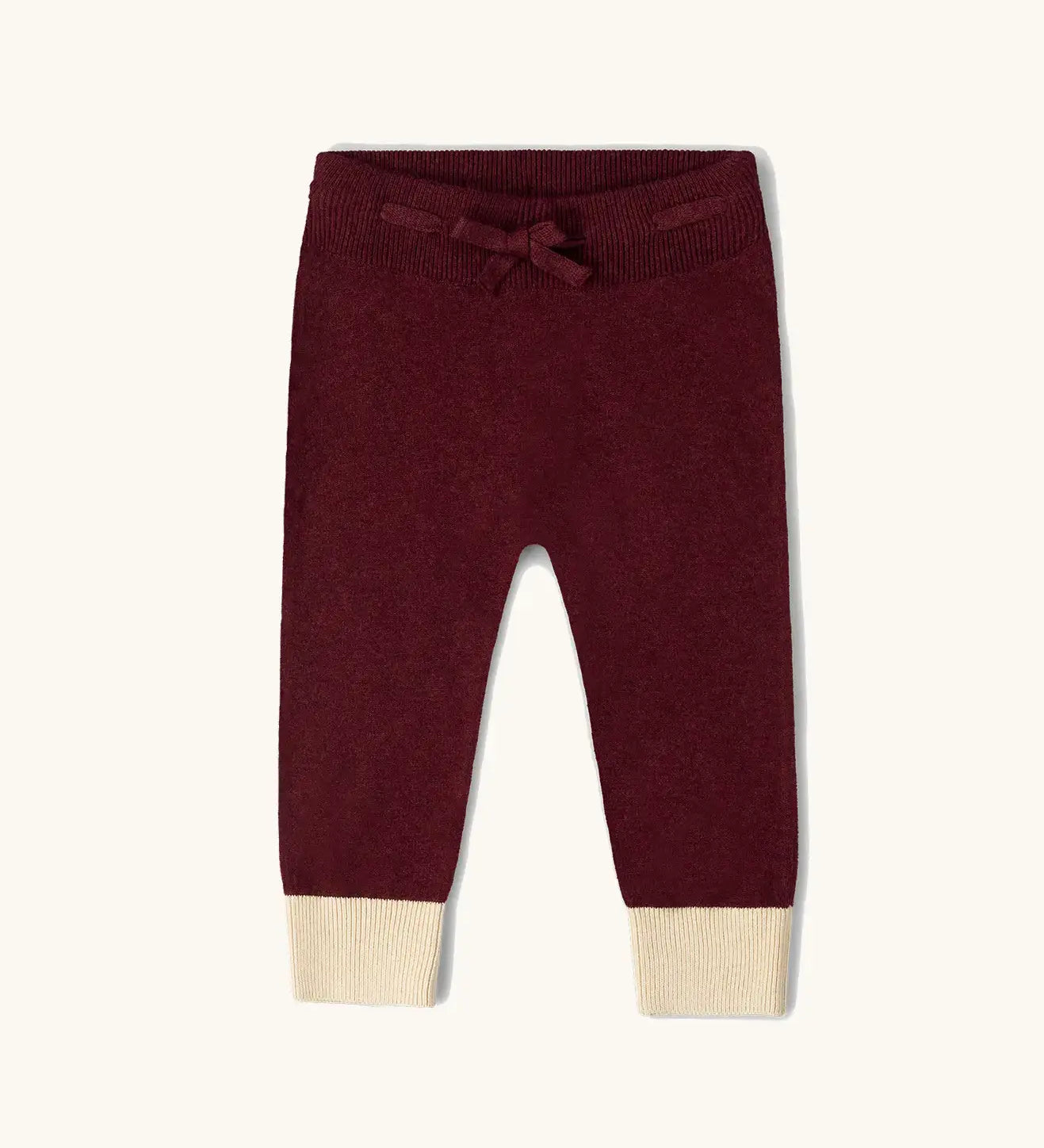 Little Green Radicals organic cotton knitted joggers in a winter berry colour.